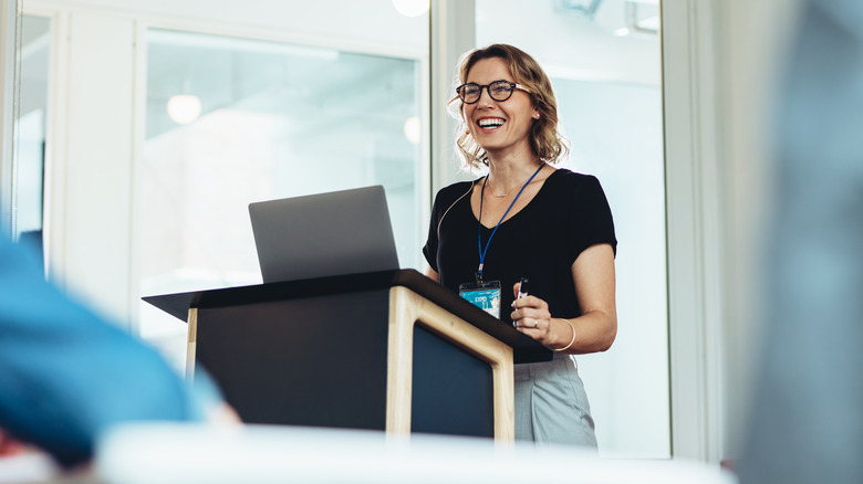 public speaker standing at a podium