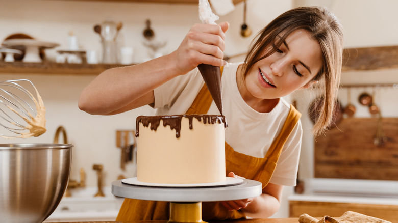 Woman decorating cake