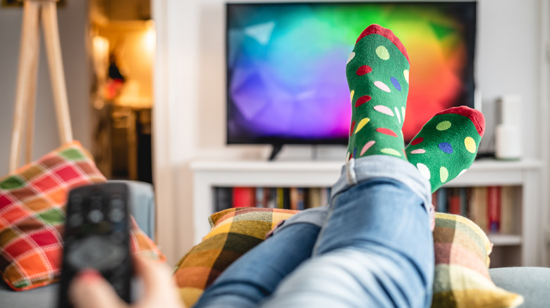 A woman watching TV