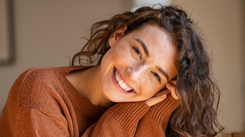 Woman with curly hair smiling