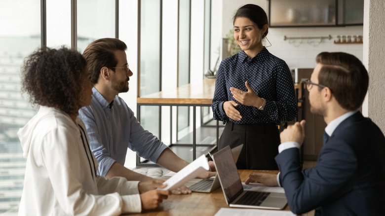 woman smiling at business meeting