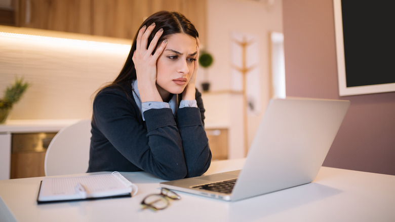 Woman upset at her desk