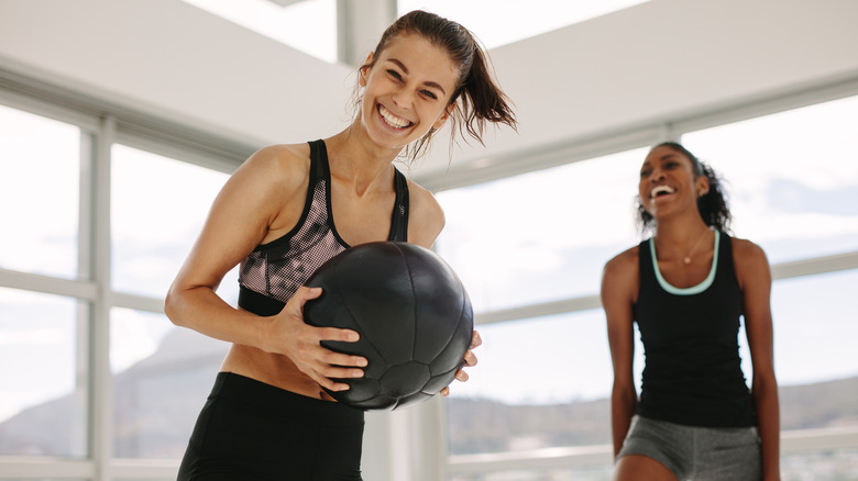 female friends laughing during workout