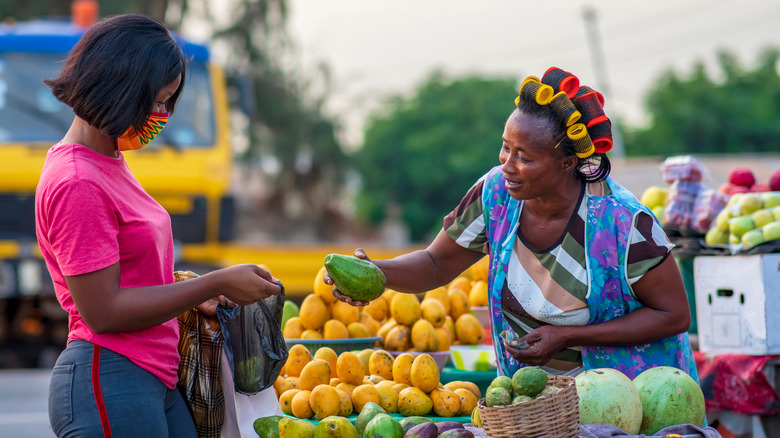 Woman shops at local fruit stand