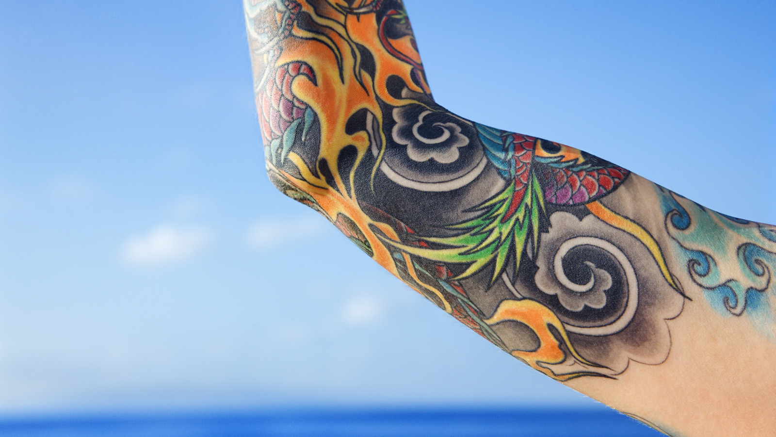 Travel Tattoo on Arm - Ace Tattooz
