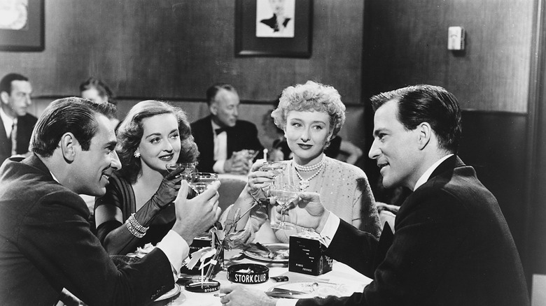 The cast of "All About Eve" toasting 