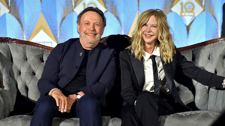 Meg Ryan and Billy Crystal pose for a photo. 