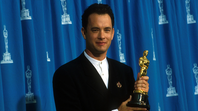 Tom Hanks holding an Oscar. 