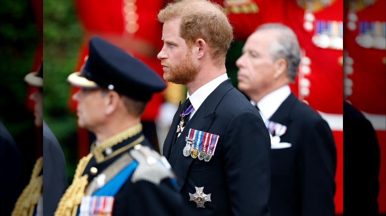 Prince Harry wearing suit with military medals