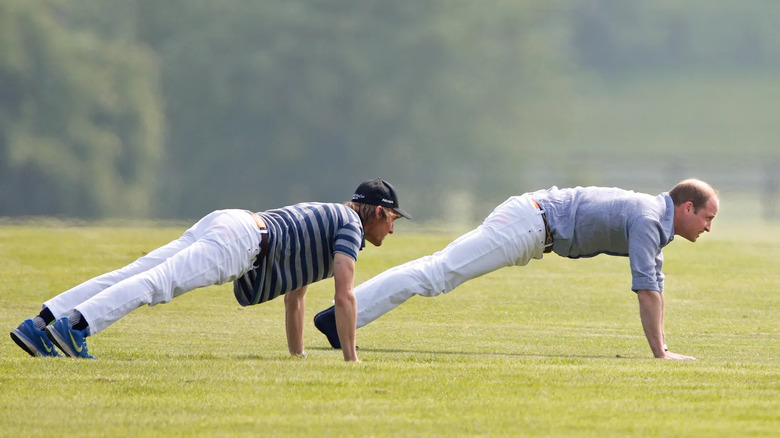 Prince William in a plank wearing white jeans