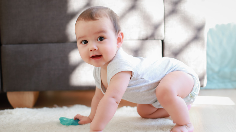 Caucasian baby boy crawling