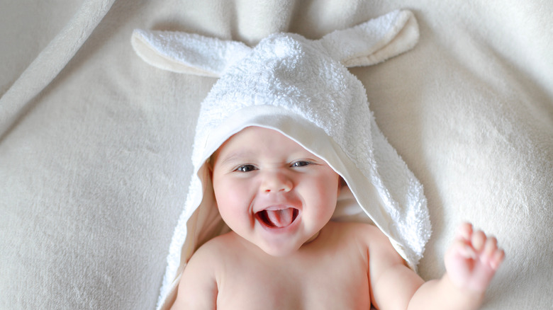 Baby with towel over head