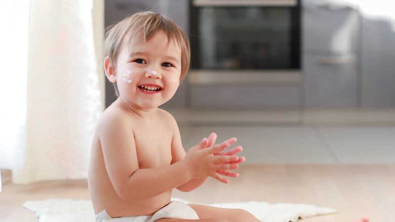 Young boy clapping his hands