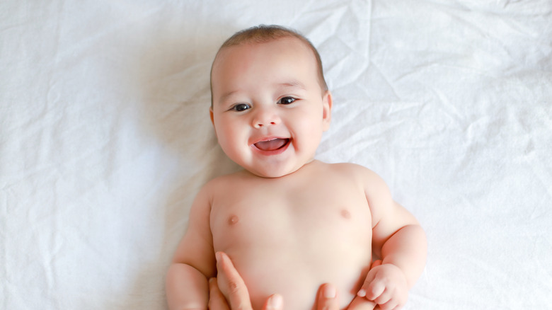 Laughing baby lying down