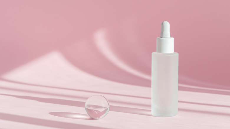 Skin serum with pink background 