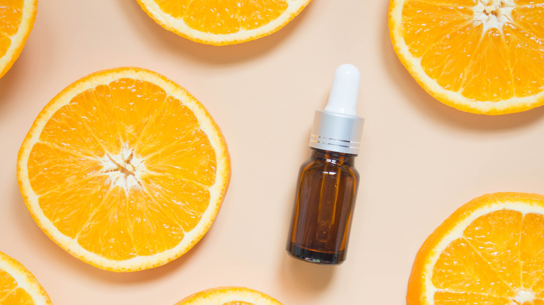 Vitamin C serum with orange slices