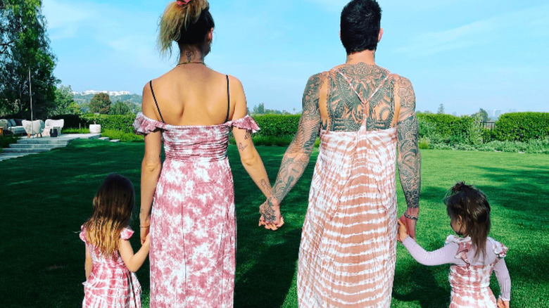 Behati Prinsloo, Adam Levine, and their children in matching outfits 