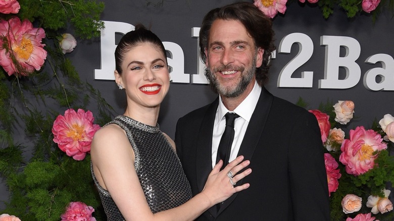 Alexandra Daddario smiling with her arm around Andrew Form