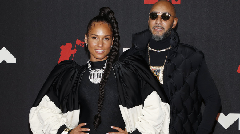 Alicia Keys and Swizz Beatz smiling