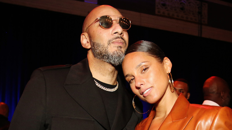 Alicia Keys and Swizz Beatz posing