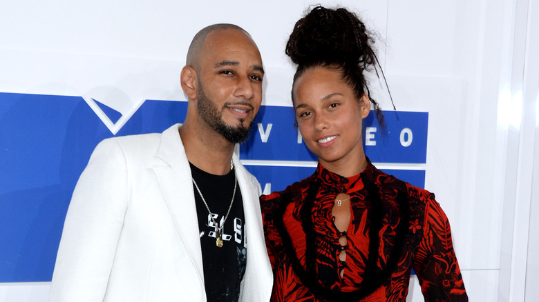 Alicia Keys and Swizz Beatz posing