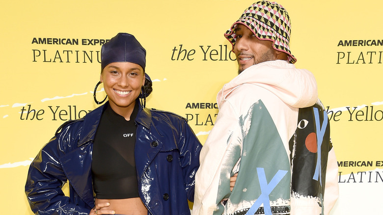 Alicia Keys and Swizz Beatz smiling