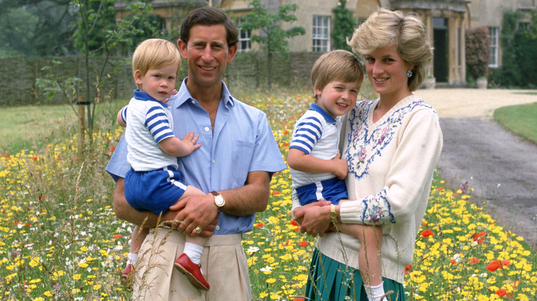 King Charles holding Prince Harry & Princess Diana holding Prince William outside house