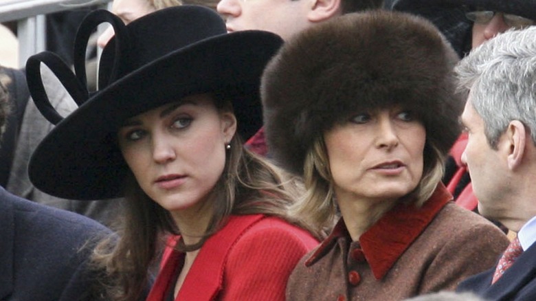 Princess Catherine and Carole Middleton sitting on bleachers