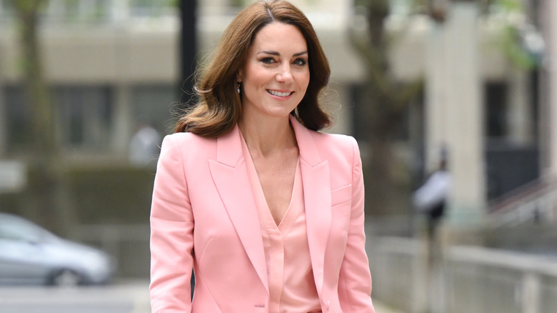 Princess Catherine smiling in pink suit