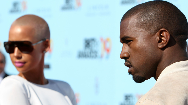 Amber Rose and Kanye West pose on red carpet