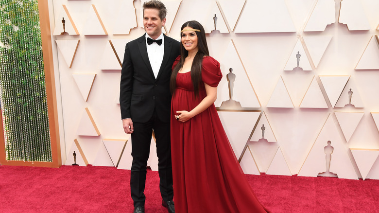 Ryan Piers Williams and pregnant America Ferrera smiling