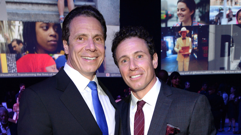 Chris and Andrew Cuomo posing at an event