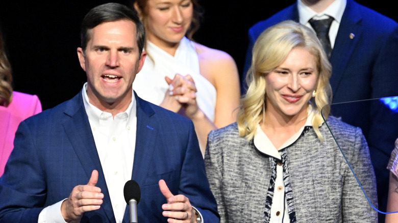 Andy and Britainy Beshear on stage