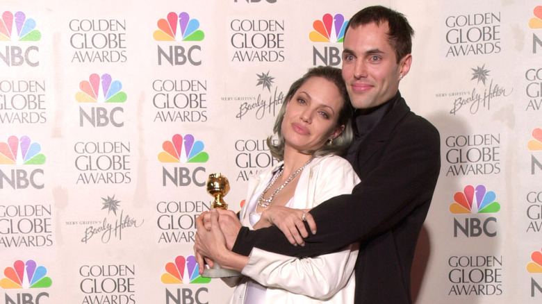 Angelina Jolie and James Haven hugging on red carpet