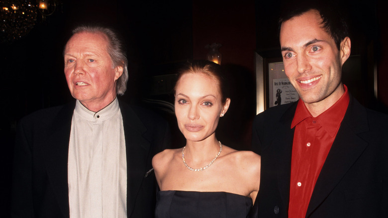 John Voight, Angelina Jolie, and James Haven posing for photo