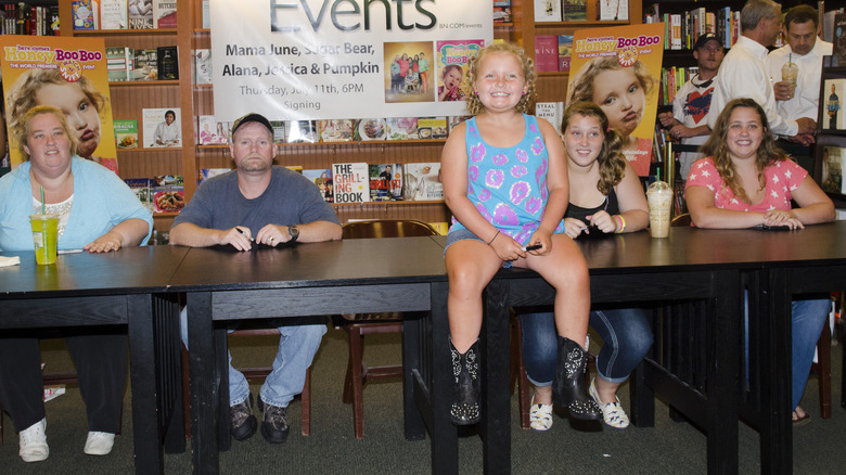 Anna Cardwell with her family at a book signing