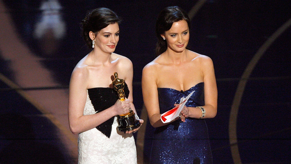 Anne Hathaway and Emily Blunt at an awards ceremony