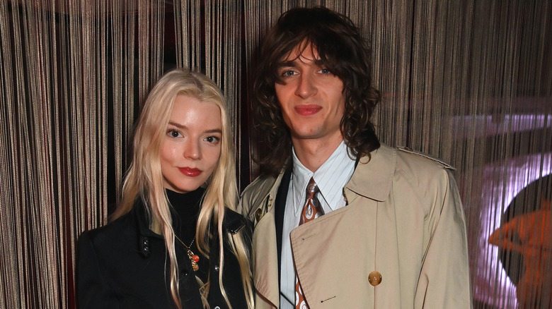 Anya Taylor-Joy and Malcolm McRae at an event