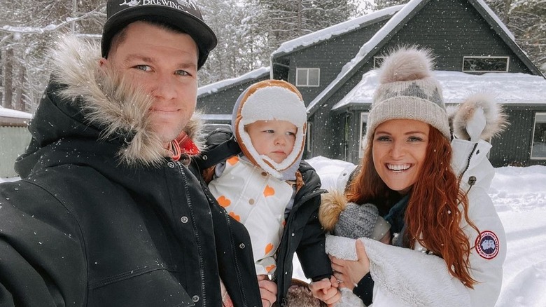 Audrey and Jeremy Roloff smiling with their kids