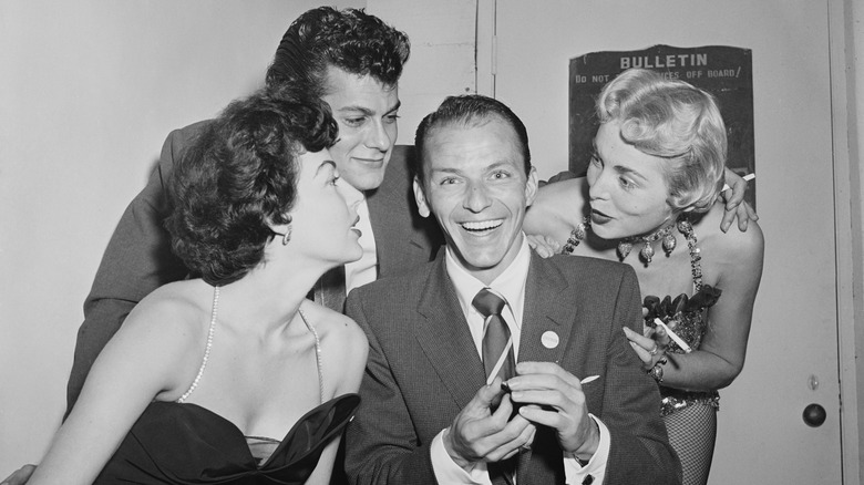 Ava Gardner, Frank Sinatra, Tony Curtis, and Janet Leigh smiling