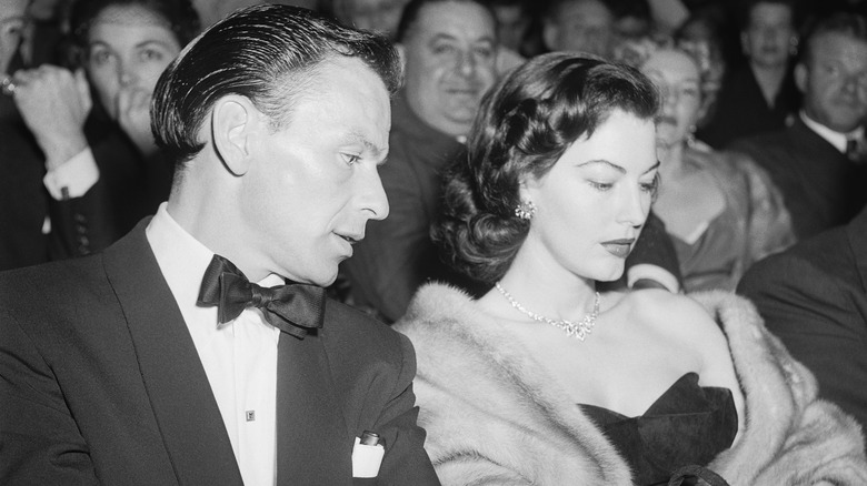 Ava Gardner and Frank Sinatra sitting in an audience