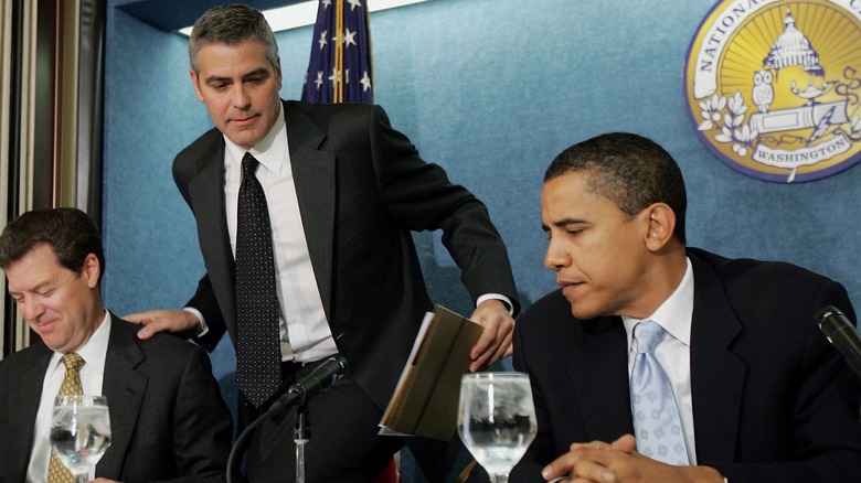 George Clooney sitting with Barack Obama