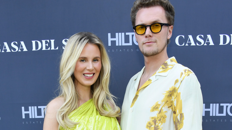 Barron and Tessa Hilton posing at event