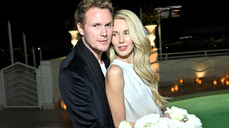 Barron Hilton and Tessa Hilton embracing