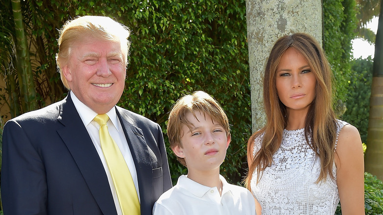 Trump family standing for photo