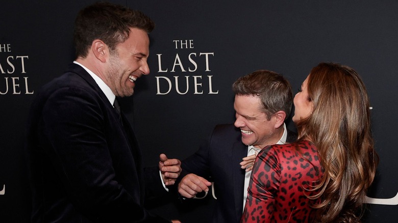 Ben Affleck, Matt Damon, and Luciana Barroso share a laugh at the premiere for "The Last Duel" in 2021