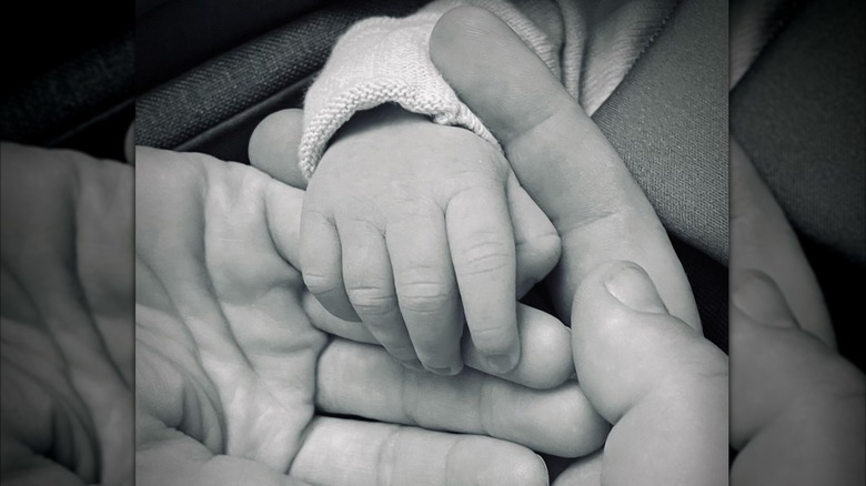 Michael Gladis and Beth Behrs with their daughter, Emma George