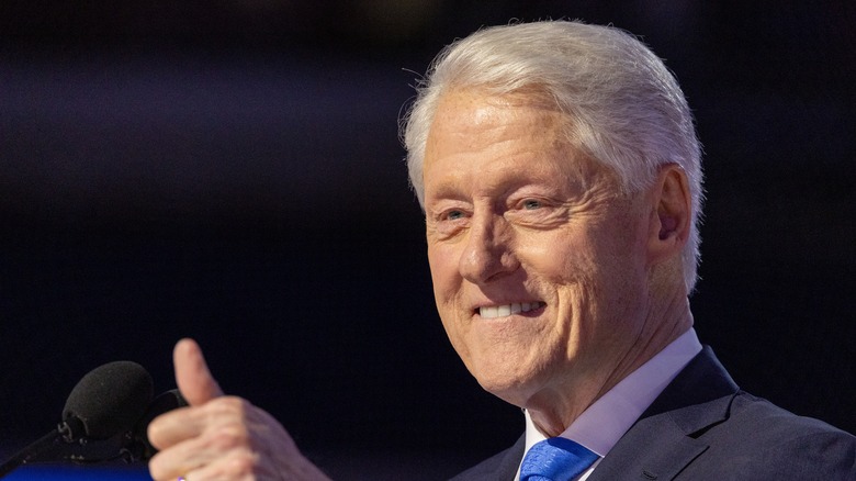 Bill Clinton smiling at a crowd