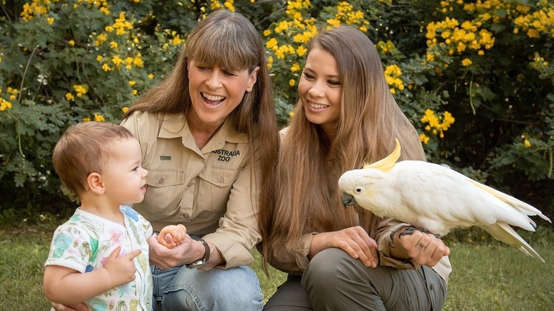 Grace, Terri and Bindi with a parakeet