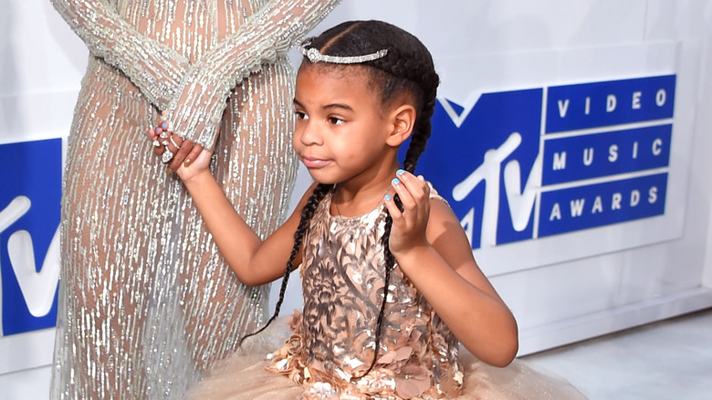 Blue Ivy walking red carpet, holding Beyonce's hand